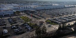 Tesla Shares Decline Following News of Lawsuit Against California: Implications for Investors.