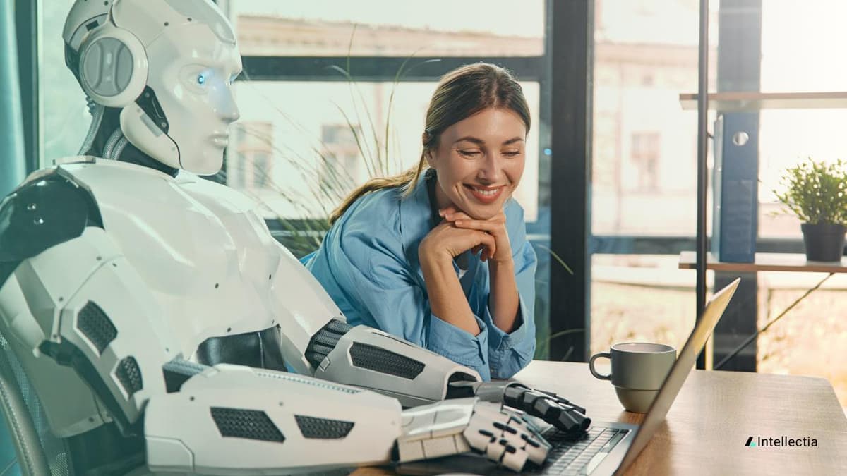 an image of 1280_x_720px_women_beside_a_robot_looking_at_a_computer_Intellectia