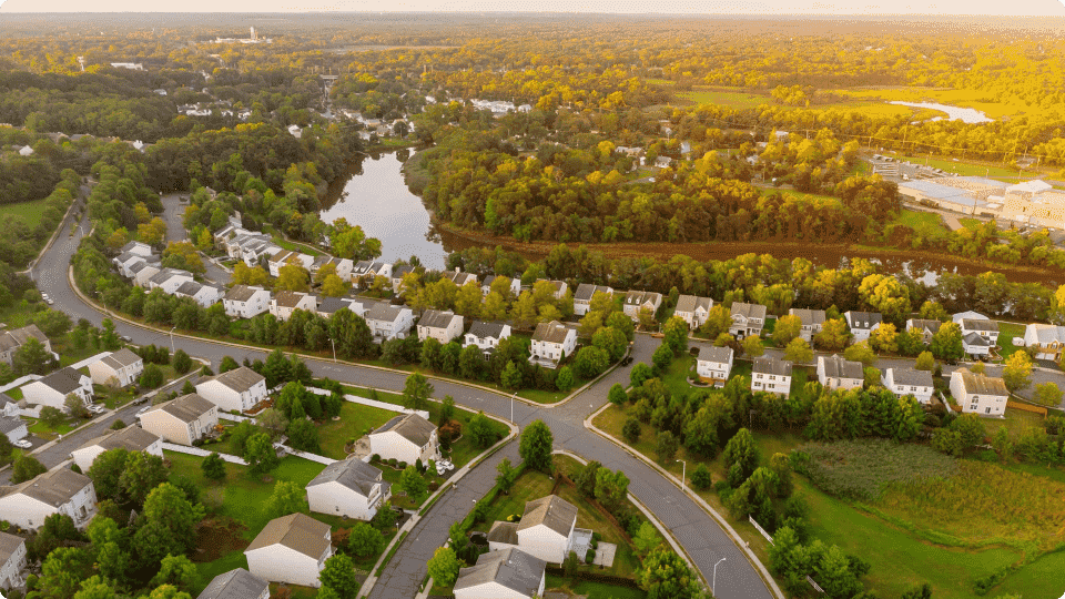 an image of An allotment of houses surrounded by trees